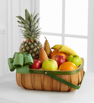 The FTD® Thoughtful Gesture™ Fruit Basket Flower Bouquet